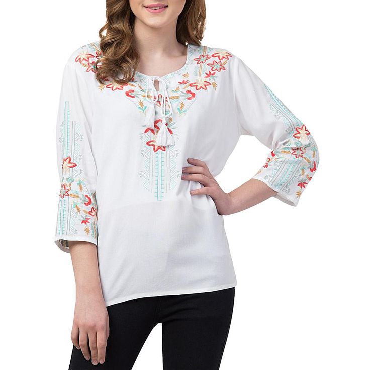 Raj Dahlia Tunic This elegant tunic is ready to make a statement with detailed floral embroidery and beautiful tassels to add on-trend interest. Pair with your favorite jeans and you're ready to go! Spring Bohemian Top With Embroidered Hem, Bohemian Spring Embroidered Tunic Top, Casual Embroidered Spring Tunic Top, Floral Embroidered Top For Fall Vacation, Spring Bohemian Embroidered Tunic Top, Floral Embroidered Top For Vacation In Fall, Spring Vacation Embroidered Neckline Top, Spring Vacation Embroidered Top With Embroidered Neckline, Casual Blouse With Geometric Embroidery For Spring