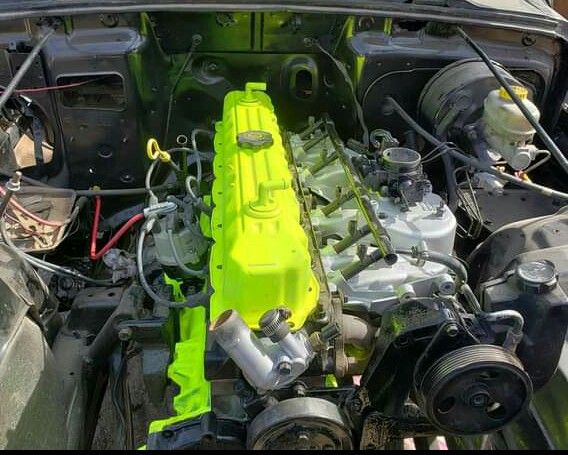 the engine compartment of a car with its hood open