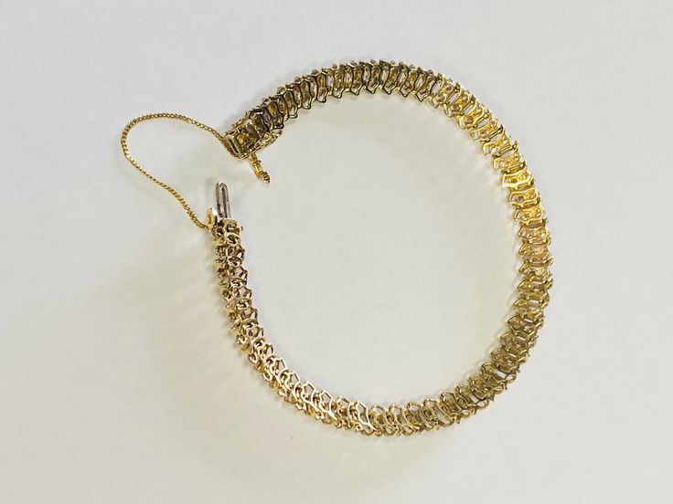 "This is an elegant 14K yellow gold and diamond tennis bracelet. Material(s): 14K yellow gold + (60) diamonds 0.03 points each (Total diamond weight: 2 carats) Weight: 21.1 grams Flaws (if any): None to mention Marking(s): \"14K\" Inside of bracelet measures 7 inches and 5.3 millimeters. If you have any questions about this diamond tennis bracelet, please do not hesitate to contact us! ♥" Yellow Gold Bangle, Diamond Tennis Bracelet, Star Bracelet, Gold Bangle Bracelet, Tennis Bracelet Diamond, Wedding Bracelet, 2 Carat, Tennis Bracelet, Gold Bangles