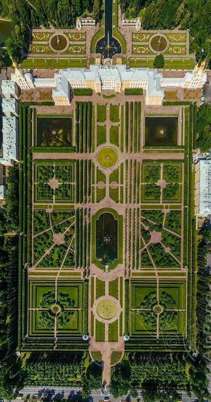 an aerial view of a large building in the middle of a park