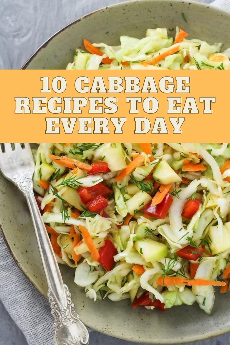 a bowl filled with cabbage and carrots next to a fork