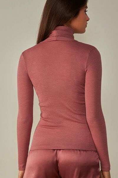 Long-sleeve high-neck tubular top made from a wool-silk blend. Fitted High Neck Turtleneck, Elegant High Stretch Funnel Neck Tops, Elegant Ribbed Funnel Neck Top, Elegant Fitted Mock Neck Top For Winter, Elegant Winter Mock Neck Top, Solid High Neck Fine Knit Top, High Neck Fitted Long Sleeve Top For Fall, Fitted Mock Neck Top With Funnel Neck For Fall, Chic High Neck Long Sleeve Top For Winter