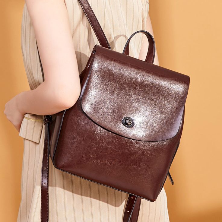 Women's Top Grain Leather Backpack Simple Style City Backpack Natural Cowhide Leather Rucksack Classic Elegant Leather Backpack Model Number: SX886 Dimensions: 9"L x 4.7"W x 10.6"H / 23 cm(L) x 12 cm(W) x 27 cm(H) Weight: 1.87 lb / 0.85 kg Hardware: Silver Hardware Shoulder Strap: Adjustable Color: Brown / Coffee / Black Features: • Genuine Natural Leather• Inside 1 Wallet Pocket, 2 Zipper Pockets.• YKK Zipper• Adjustable Shoulder Strap• Can fit an iPad mini, iPhone, Books, Files, Mini Umbrella, Leather School Bag, Vintage Leather Backpack, Women Backpack Travel, Simple Backpack, Female Shoulder, City Backpack, Leather Rucksack, Backpack Women, Women Travel