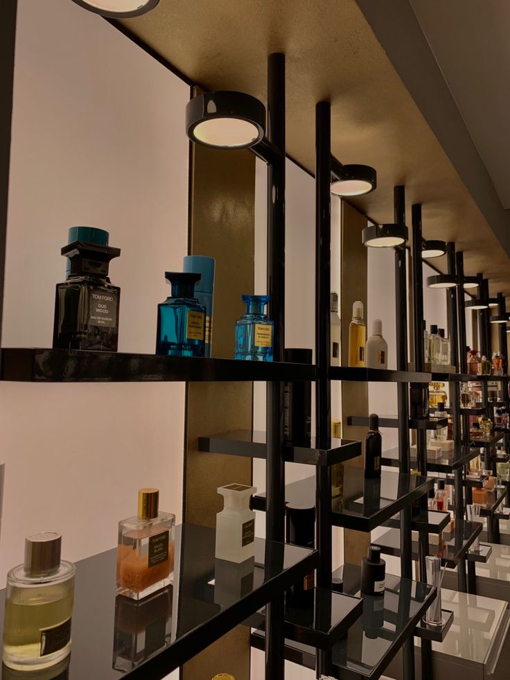 the shelves are filled with different types of perfumes