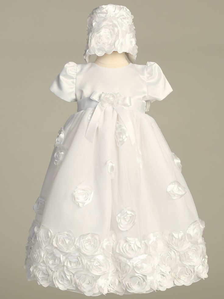 Details This floral ribbon tulle Christening gown is beautifully detailed for your little girls special day. The elegant full tulle gown has floral ribbon roses on the skirt and is finished with three rows of ribbon roses all along the bottom hem and along the bonnet. A satin bow and flower adorn the sash at the waist. Cap sleeves. Sizes Available: X-Small (0-3 Months), Small (3-6 Months), Medium (6-12 Months), and Large (12-18 Months) 100% Polyester. Hand Wash Cold - Do Not Use Bleach - Hang Dr Tulle Baptism Dress With Floral Applique For First Communion, First Communion Dress With Floral Applique For Baptism, First Communion Tulle Dress With Floral Applique, Tulle First Communion Dress With Floral Applique, Fitted Tulle Baptism Dress With Floral Applique, Tulle Baptism Dress With Satin Bow For First Communion, Fitted Tulle First Communion Dress With Floral Applique, Fitted Organza Ball Gown For First Communion, Fitted Organza Ball Gown For Baptism