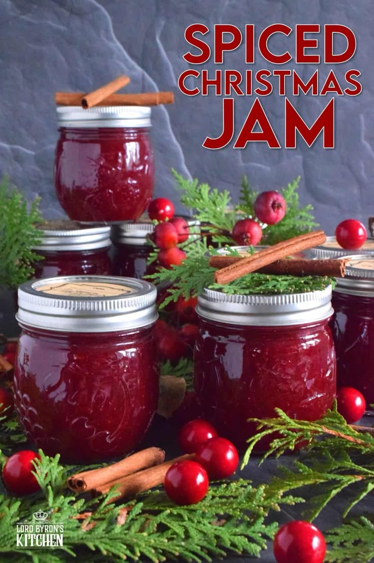 homemade spiced christmas jam in jars with cinnamon sticks and cranberries on the side