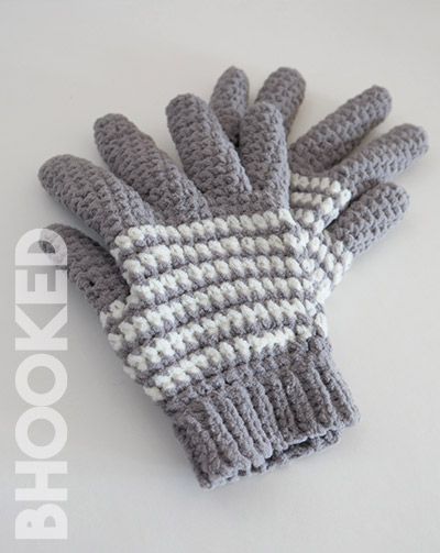 a pair of gray and white knitted gloves