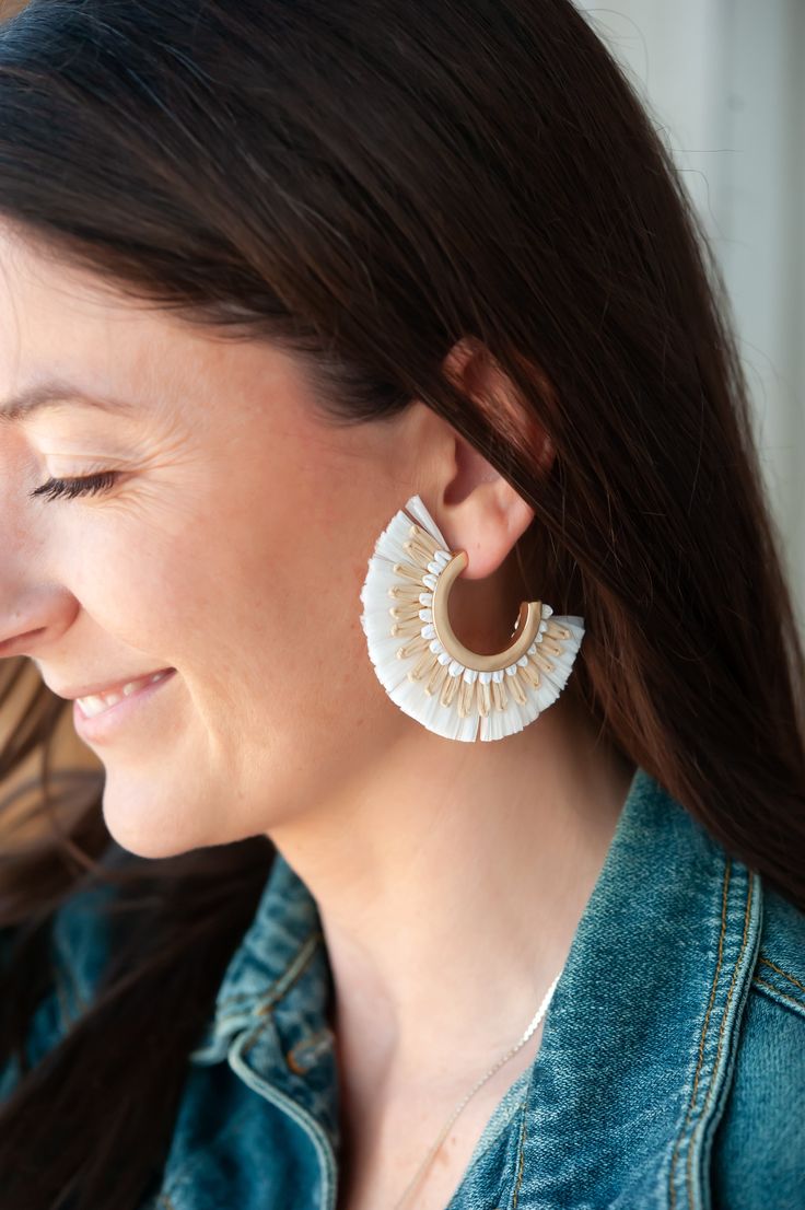 The Allison Rattan Fan Hoops are a delightful pair of earrings that embody the essence of a tropical vacation with a bohemian twist. Crafted with intricately woven rattan, these hoop earrings exude a sense of natural elegance. The unique fan-shaped design adds a touch of whimsy to the accessory, making them perfect for those seeking a playful and carefree style. Available in four stunning color options, these earrings allow you to express your personal taste and effortlessly enhance any outfit w Rattan Fan, Carefree Style, Bohemian Twist, Woven Rattan, Personal Taste, Tropical Vacation, Earrings Boho, Summer Festival, Boho Earrings