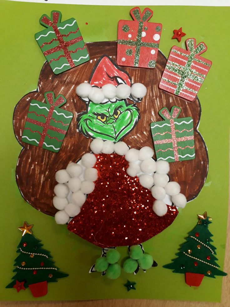 the grino christmas card is decorated with green and red decorations