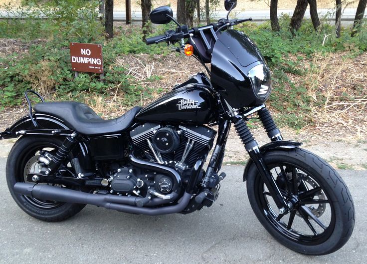 a black motorcycle is parked on the street