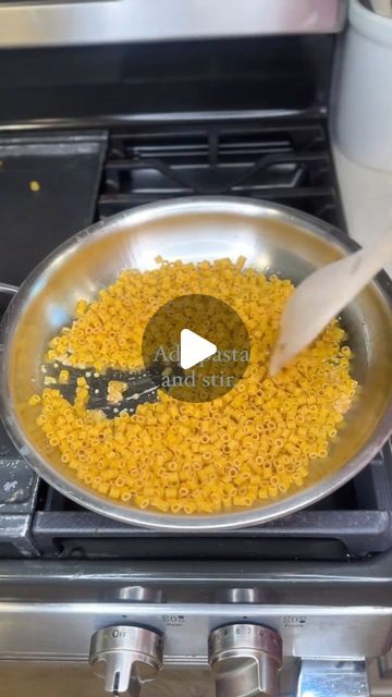 a frying pan filled with food on top of a stove