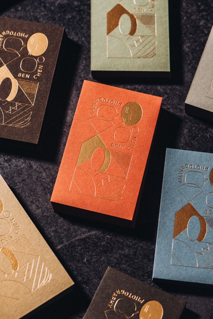 six different colored cards with gold foil on them, all in various shapes and sizes