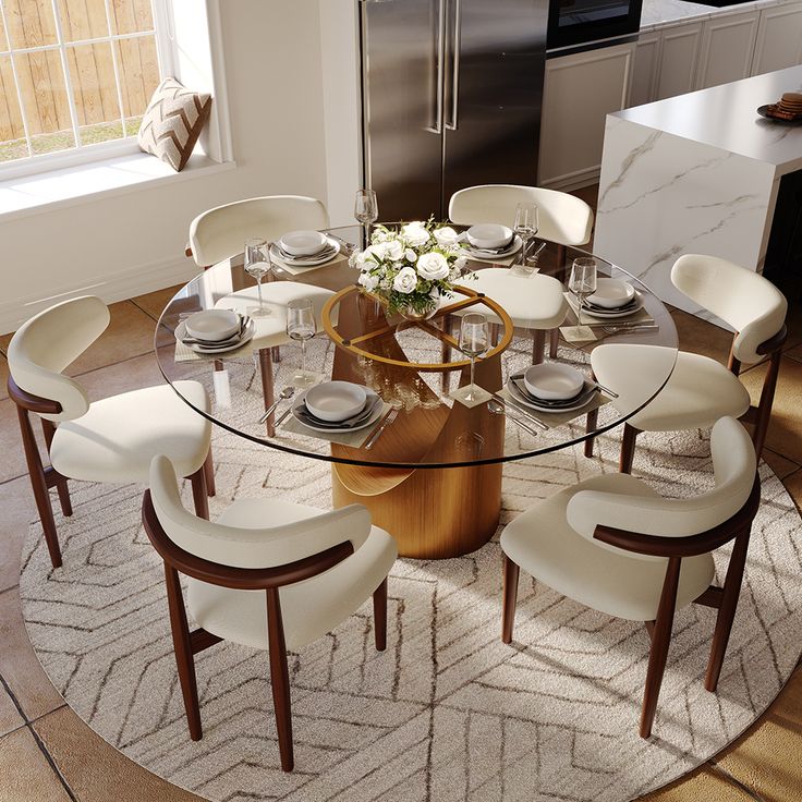 a round glass table with white chairs around it in a modern style kitchen and dining room