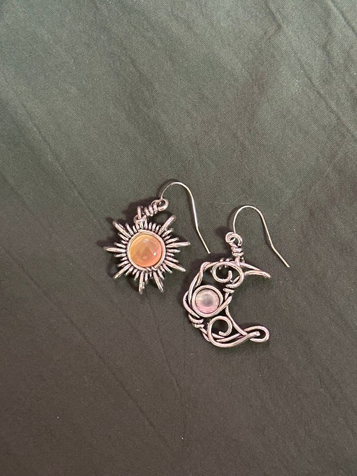 Enchant yourself or a loved one with these beautiful bohemian sun and moon drop earrings. The perfect gift for any lover of the stars!  These earrings are silver plated.  Jewellery care🔮 To ensure the longevity of this jewellery keep away from water for example showering or swimming etc.   Avoid harsh chemicals such as perfumes and sprays and remove jewellery before going to bed.  To clean jewellery just wipe with a soft cloth or ear bud. Sun And Moon Drop, Sun And Moon Earrings, Bohemian Sun, Ear Bud, Moon Drop, Before Going To Bed, Going To Bed, Moon Earrings, Sun And Moon