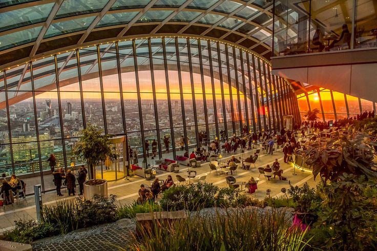 the sky garden at the walkie talkie building in london, england during sunset