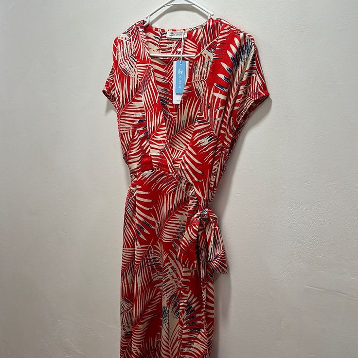 Low V Neck Cut, Cap Sleeves, Tie At The Waist. Casual Short Sleeve Midi Dress For Holiday, Red Rayon Maxi Dress For Beach, Summer Red Printed Midi Dress, Red Printed Midi Dress For Vacation, Red Rayon Beach Dress, Red Rayon Summer Dress, Red Short Sleeve Rayon Dress, Red Printed Beach Midi Dress, Red Printed Midi Beach Dress