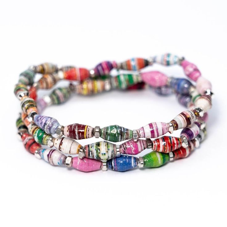 These fun bracelets come in a variety of colors and are made of 100% recycled paper beads handcrafted by Masai women. In between each bead are beautiful faceted copper, brass, or silver spacers. They are perfect to stack with any of our other paper bead bracelets or mix it up with one of your own! How you can make a difference: Each bracelet provides 200,000 gallons of clean water. Just 5 bracelets = 1 water filter = 1 million gallons of clean water! :: Product Details :: Color: a combination of Masai Women, Paper Beads Diy, Bracelet Trio, Paper Bead Bracelet, Paper Bracelet, Triple Wrap Bracelet, Paper Bead Jewelry, Fun Bracelet, Changing The World