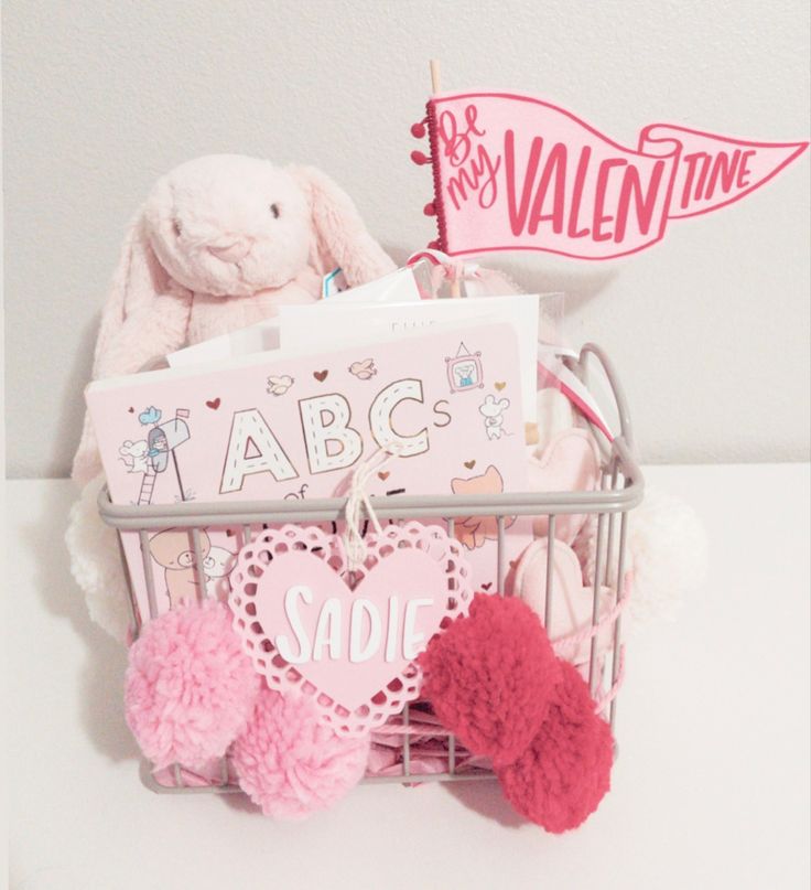 a basket filled with valentine's day items on top of a table