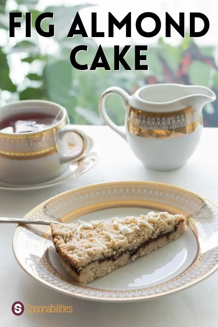 a piece of cake sitting on top of a plate next to a cup and saucer