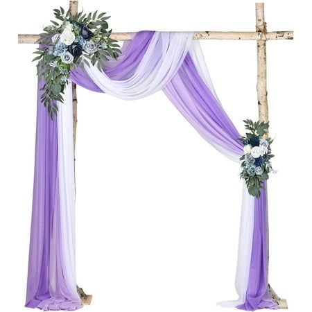 a purple and white wedding arch decorated with flowers