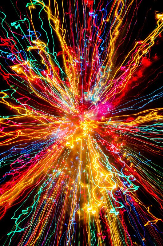 colorful fireworks are lit up in the night sky with bright lights and long exposures