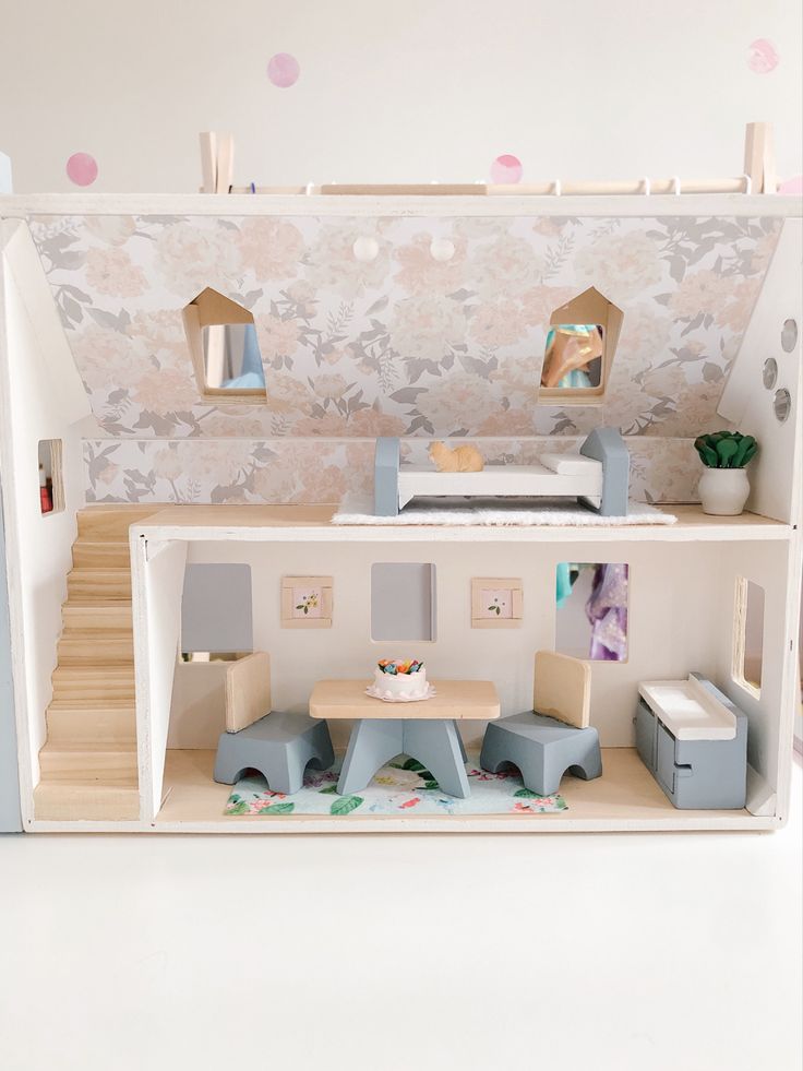 a doll house with furniture and accessories in it