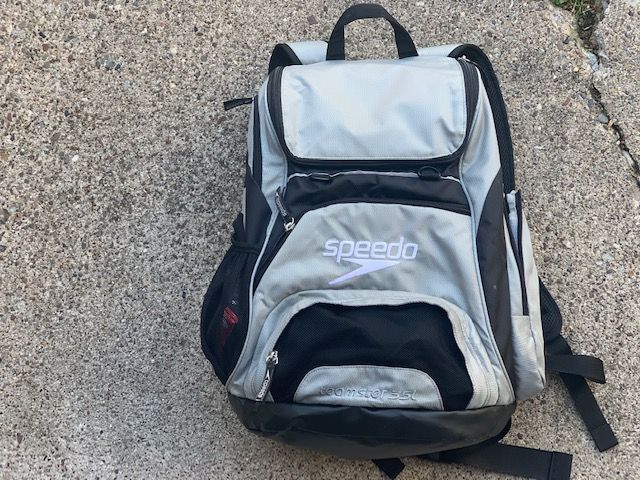 a back pack sitting on the ground