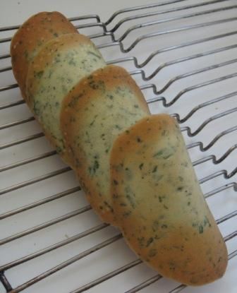 three pieces of bread sitting on top of a cooling rack