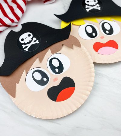 two paper plates with pirate faces on them