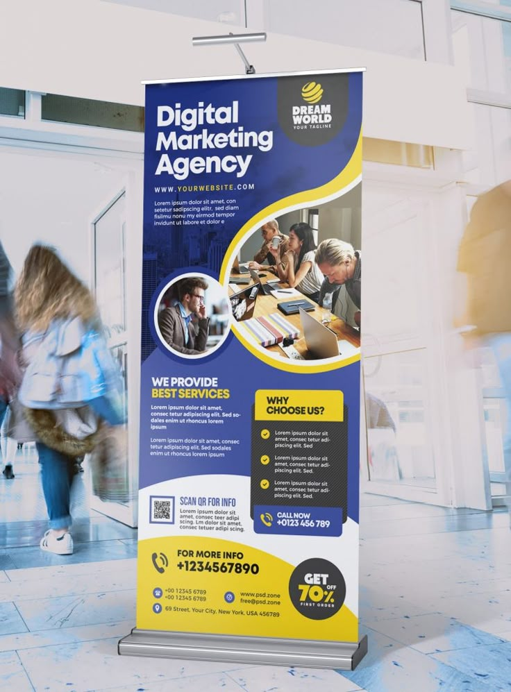 a blue and yellow digital marketing banner with people walking by in an office building,