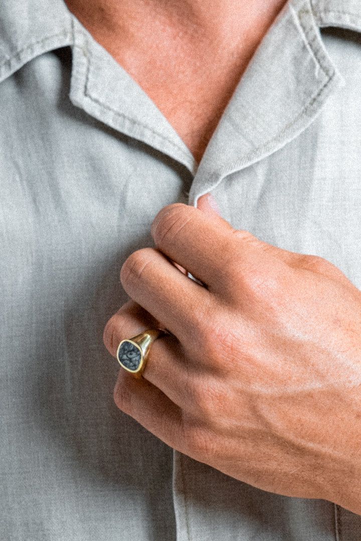 Harkening back to antique rings found at swap meets and on your grandpa's hand, our signature signet style is designed to be well worn. Made with either sterling silver, 14k or 18k gold, the ring will only get better with age. Pinestone, scientifically named Pinolith, is an extremely rare stone consisting of Howlite, Dolomite and Graphite that takes its name from its pine nut shaped crystals. No two Pinestones are the same and each has its very own, one-of-a-kind patterns. The stone symbolizes i Gold Miners, Fair Trade Jewelry, Signet Ring Men, Rare Stone, Gold Signet Ring, Stone Inlay, Recycled Sterling Silver, Get Better, Antique Rings