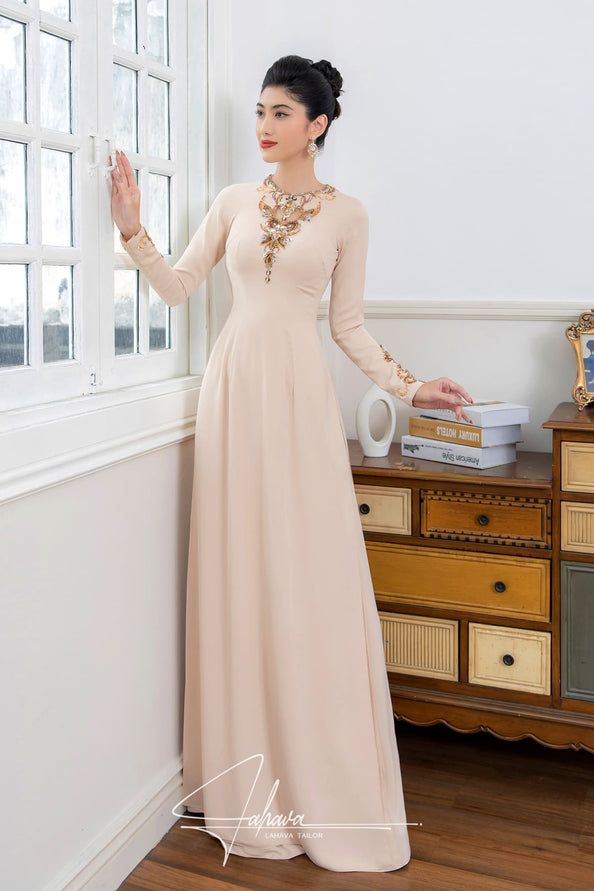 Elegant round neck beaded ao dai – LAHAVA Elegant Embroidered Maxi Dress, Embroidered Long Sleeve Evening Dress, Traditional Long Sleeve Evening Dress, Traditional Long Sleeve Formal Evening Dress, Traditional Long Sleeve Ao Dai For Banquet, Elegant Long Sleeve Embroidered Ao Dai, Elegant Embroidered Ao Dai For Evening, Elegant Embellished Long Sleeve Ao Dai, Eid Evening Dress With Embroidered Neckline