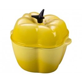 a yellow casserole dish with an apple shaped lid and black plastic spoon in it