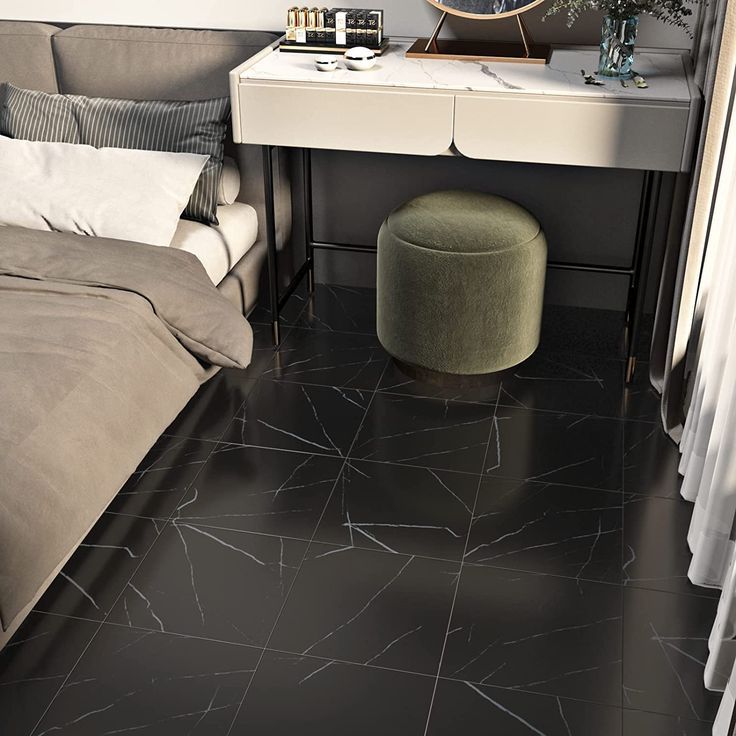 a bedroom with black flooring and white walls