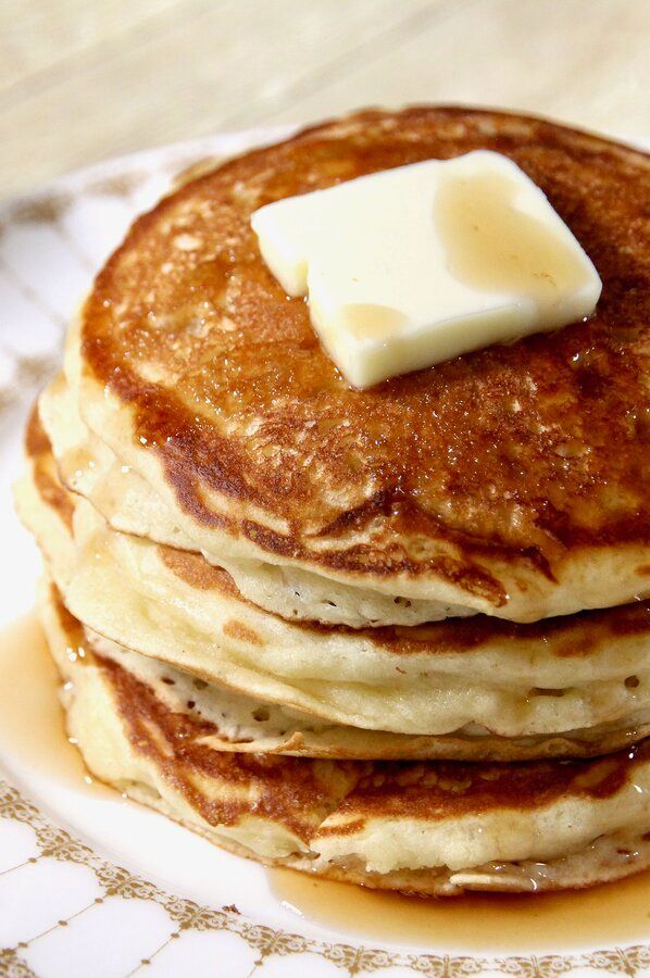 a stack of pancakes with butter on top