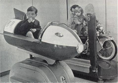 two children are sitting in the back of an airplane