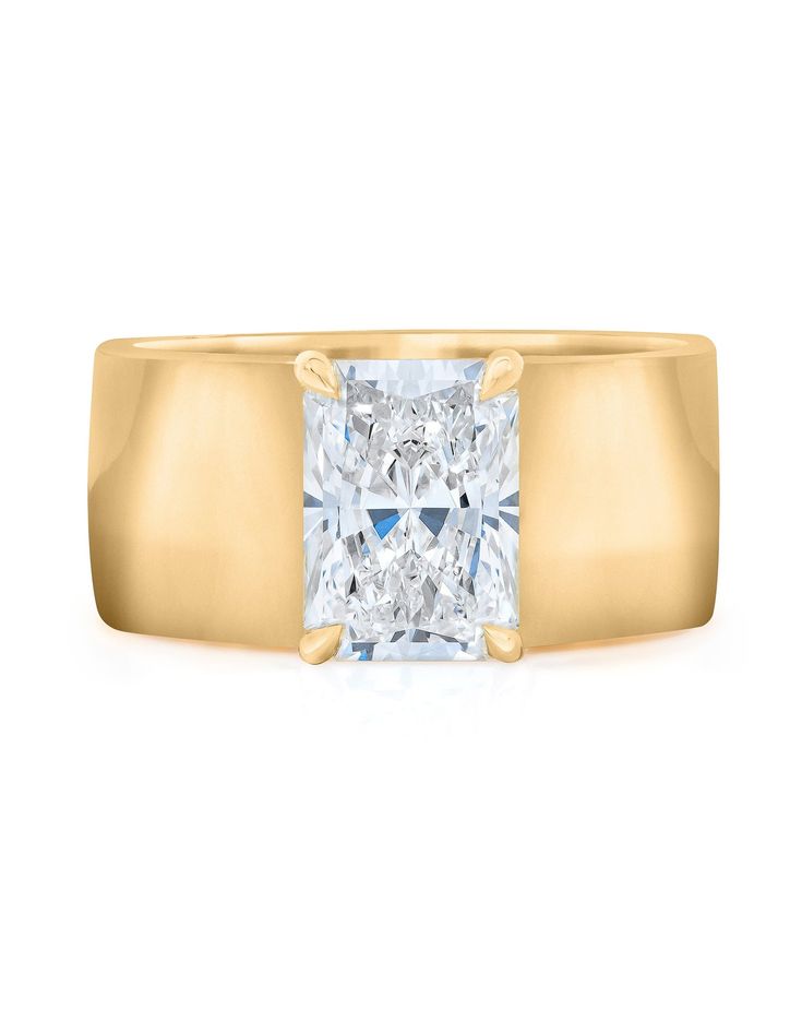 a yellow gold ring with a princess cut diamond