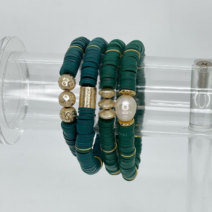 Heishi stretch bracelets are fun and lightweight. Wear them in stacks and have fun mixing and matching the colors. This hand beaded bracelet is made with high quality 8mm Heishi beads and gold accents. Available in 4 different styles:- Gold Bar- Gold Saucers- Fancy Round- Pearl Bracelets are “one size fits most” and are designed to fit wrists up to 7.0”. Custom sizes available upon request. Please email designsby.kb@yahoo.com once your oder is placed. *Bracelets usually ship within 3-5 business Heishi Bracelets, Marbled Clay, Green Bracelet, Pearl Bracelets, Chic Bracelet, Stackable Bracelets, Heishi Beads, Gold Bar, Hunter Green