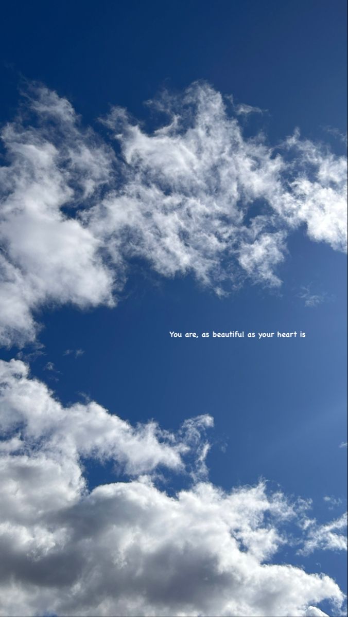 the sky is filled with white clouds and there are some words written on it that say you are beautiful as your heart is