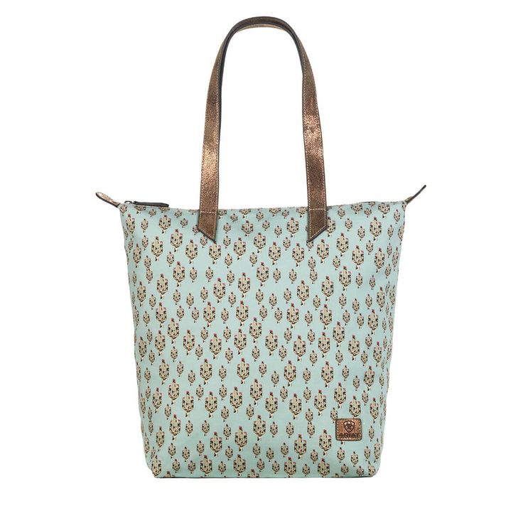 This take-everywhere cotton tote was designed with the same pattern as one of our popular Cruiser styles. It features a bold splash of turquoise, fun cactus print, and genuine leather metallic gold/brown handles. Finished with a premium leather Ariat patch. Cruiser tote bag | Women's Cruiser tote bag Casual Shoes in Turquoise Cotton/Leather, Size: OS by Ariat Ariat Cruisers, Cactus Tote, M F, Brown Leather Strap, Womens Purses, Leather Patches, Cotton Totes, Casual Bags, Metallic Gold