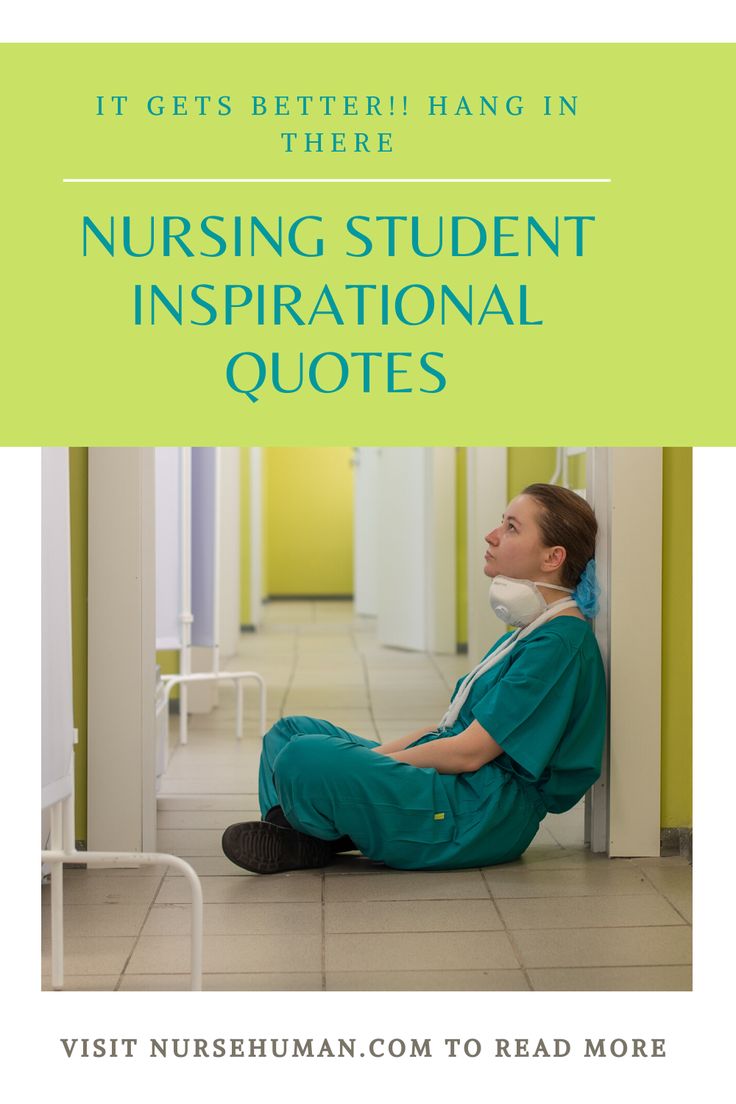 a woman in scrubs sitting on the floor next to a wall with text that reads it