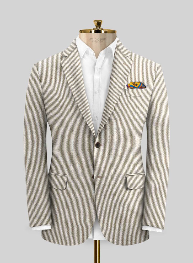 If your goal is to grab an ironically unique suit then our Solbiati Light Brown Seersucker suit is all set to fulfill your goal. Crafted from 100% cotton, brown is the most classic stripe color that has the unique potential to make one look grandeur and modern. 
 
Seersucker's name comes from the persian word: "SHUR E SHAKAR" which means sugar and milk, signifying the alternation of smooth and rough. The fabric is purely summer and due to its curled characteristic feature, it does not rest entir Formal Striped Cotton Blazer, Formal Brown Cotton Blazer, Tailored Striped Linen Blazer, Striped Cotton Blazer For Formal Occasions, Pinstripe Linen Blazer With Notch Lapel, Classic Striped Cotton Blazer, Classic Striped Linen Blazer, Seersucker Jacket, Seersucker Suit