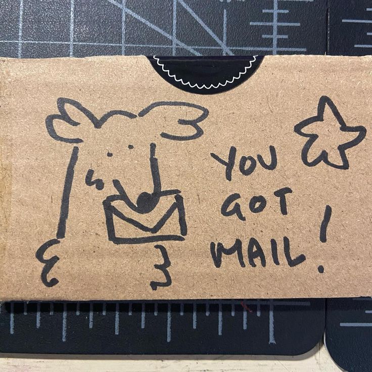 a piece of cardboard with a drawing of a cow on it's back and the words, you got mail