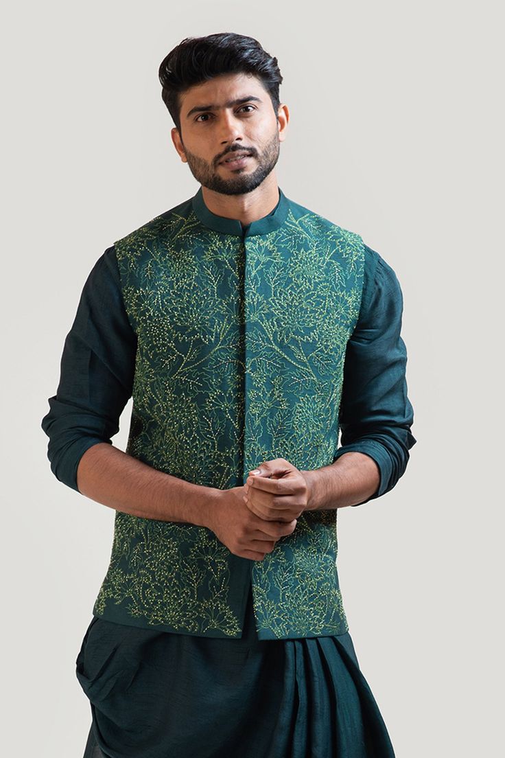 Moss green nehru jacket in bam silk with embroidery work. 
Component: 1
Embroidered
Neckline: Band
Sleeve Length: Sleeveless
Fabric: Bam Silk
Color: Green
Contrast embroidery
Front closure
Side slit
Note: The kurta and the pant worn by the model is not for sale - Aza Fashions Nehru Jacket For Men, Sherwani For Men Wedding, Contrast Embroidery, Green Drapes, Sherwani For Men, Pleated Drapes, Vacuum Storage, Nehru Jacket, Nehru Jackets