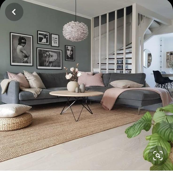 a living room filled with lots of furniture and pictures on the wall above it's coffee table