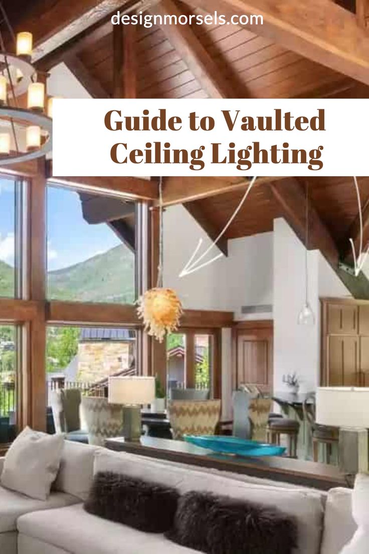 vaulted ceiling living room with text overlay guide to vaulted ceiling lighting Partially Vaulted Ceiling Living Room, Island Lighting With Vaulted Ceiling, Pendant Lighting For Vaulted Ceilings, Living Room Lighting Vaulted Ceiling, High Ceiling Lamps Living Rooms, Lighting For Tall Ceilings Living Rooms, Pendant Lighting Vaulted Ceiling, Lights For High Ceilings Living Room, Cathedral Ceiling Kitchen Lighting