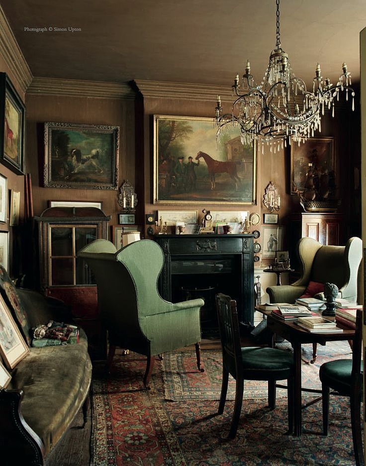 a living room filled with furniture and a chandelier