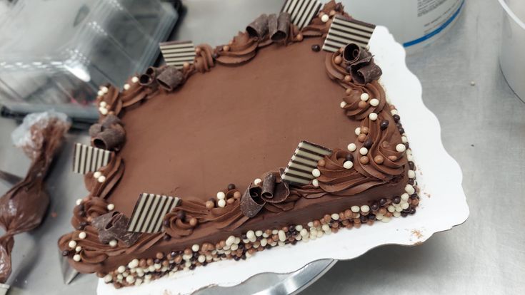 a heart shaped chocolate cake sitting on top of a table