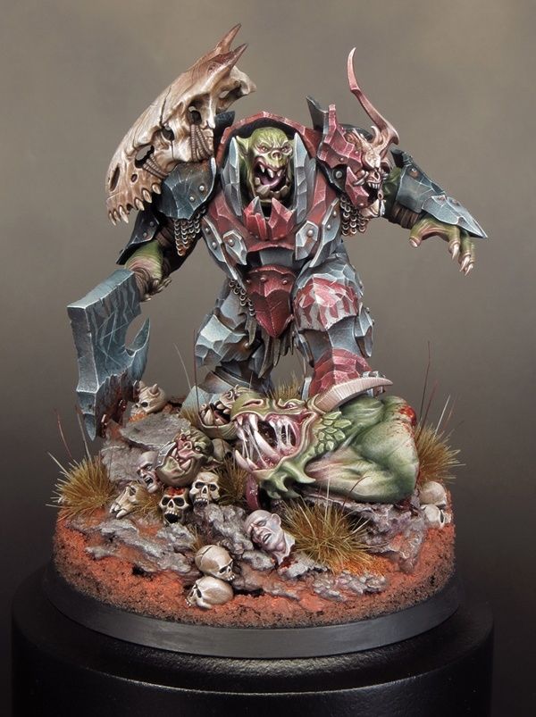 a warhammer is standing on top of a pile of skulls