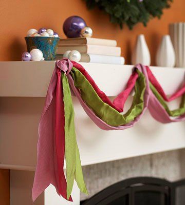 the mantle is decorated with pink, green and white ribbons on it's edge